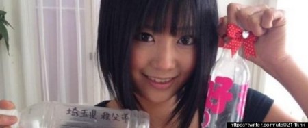 Japanese porn actress Uta Kohaku shows off two of the more than 100 bottles of semen sent to her by fans for inclusion in a new movie, "Semen Collection 2." 
