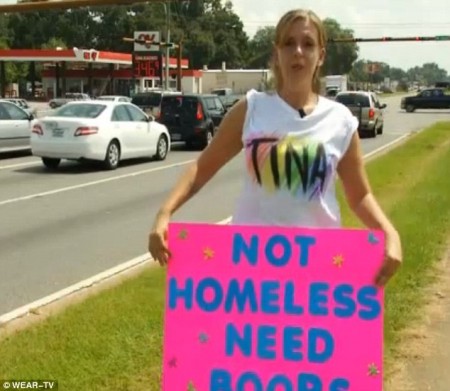 Christina Andrews of Florida stood on the side of the road with a sign that read 'Not Homeless Need Boobs' to collect money for a breast enhancement.