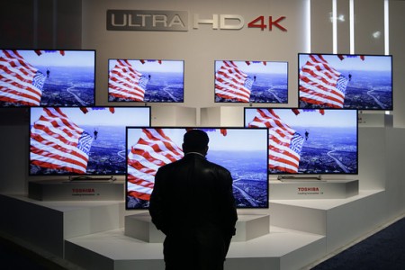 A man looks at Ultra HD 4K displays at the International Consumer Electronics Show in Las Vegas on Jan. 9. Associated Press