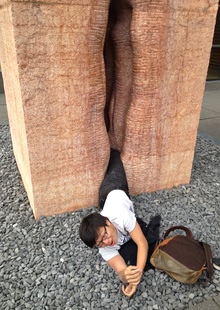 The student waits to be rescued from the giant vagina sculpture