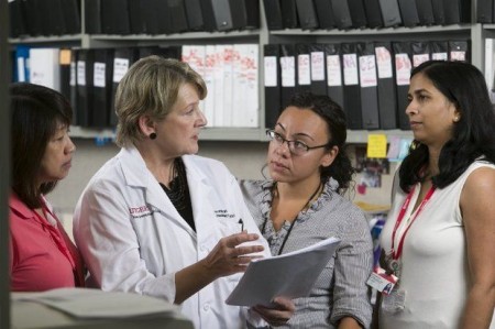 From left: Susana Rivera, nurse clinician, Sally Hodder, HIV program director, Christie Lyn Costanza, research coordinator and Shobha Swaminathan, associate HIV program director, discuss HIV prevention methods at Rutgers New Jersey Medical School in Newark. (Steve Hockstein)