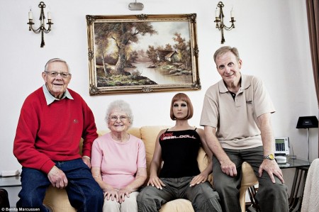 One of the family: Carl, (right), 56, lives with his parents, Geoffrey and Doreen and his doll Alektra. He was divorced from his wife 20 years ago and did try dating, but after eight years still had not met the right woman, sparking his interest in dolls. He bought the first one in 1998, and although he still has her she is packed away. Alektra, who is modelled on American porn actress Alektra Blue, is his latest purchase. Carl does not have a sexual relationship with Alektra and does not see her as a girlfriend, but solely as a doll who he likes to photograph but who will never be able to replace a real woman. He is still hoping to meet the love of his life.