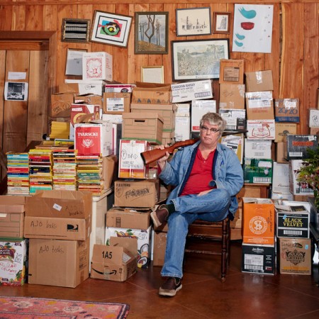 Chris Offutt at home with his father’s files and assorted heirlooms. William Mebane for The New York Times