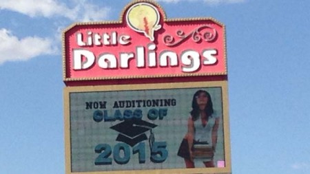 The marquee for the Little Darlings strip club in Las Vegas encourages recent high school graduates to apply for employment. (Danielle Miller/FOX5)