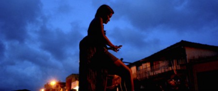 **APN ADVANCE FOR SUNDAY SEPT. 21**  A prostitute waits for clients at a street , in Abaetetuba, Para state, Brazil, May 10, 2008. When the Brazilian media discovered  that a 15-year-old girl had been locked up for weeks in a cell with 21 men, who only allowed her to eat in return for sex, it set off a national scandal. But it came as little surprise to social workers in this Amazon port city that sits along a major cocaine shipment route, where education is scarce and legitimate work hard to come by. (AP Photo/Renato Chalu)