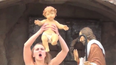 Topless Feminist Steals Baby Jesus From Vatican Nativity Display